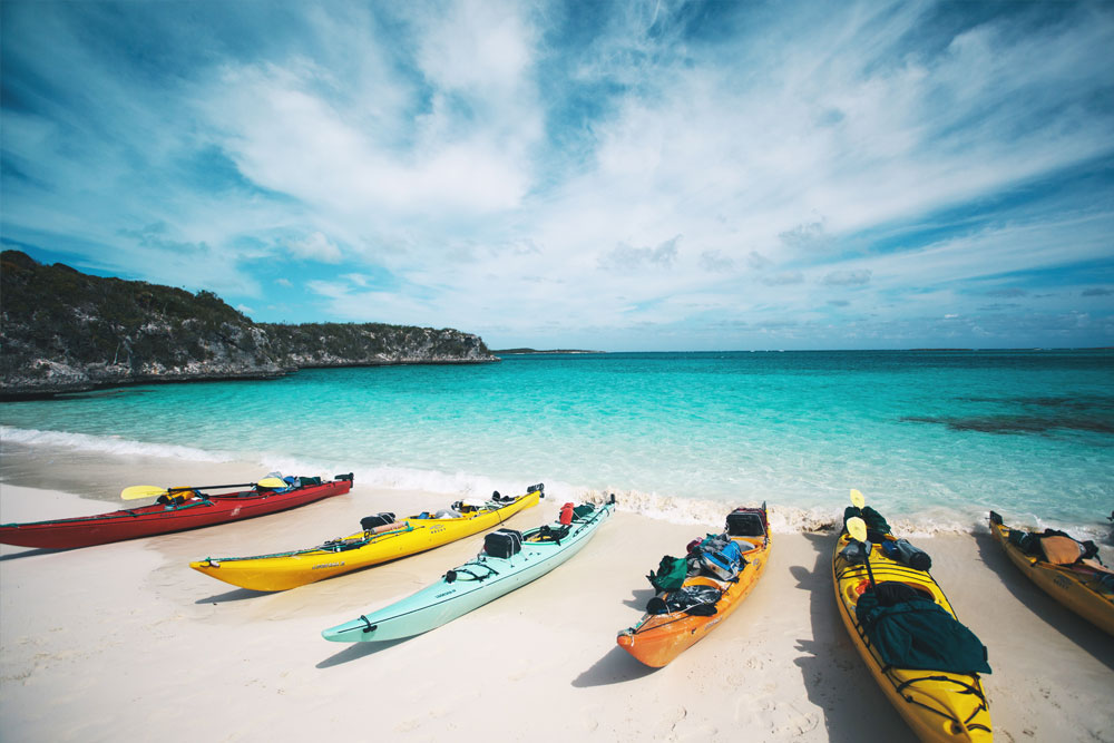 Sea kayaks on sandy beach Bahamas