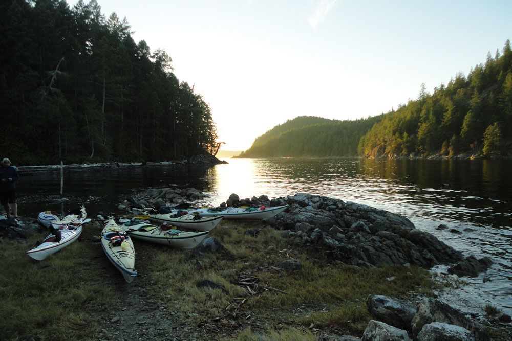 Kayaks on rocky shore