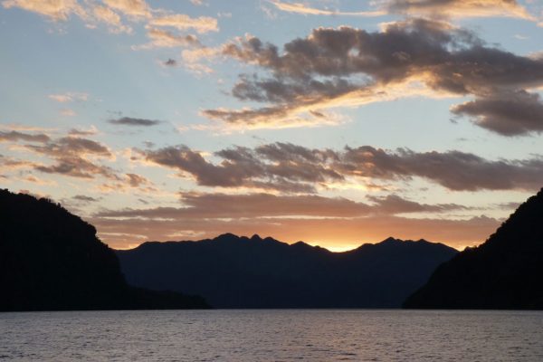 The sun setting over Chilean mountains in Patagonia