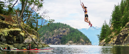 Girl swinging into water desolation sound