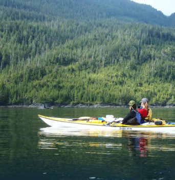 Two kayaks admiring the BC coastal mountains