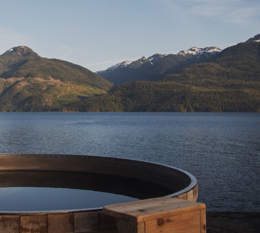 A wood-fired hot tub with views overlooking The Johnstone Strait.