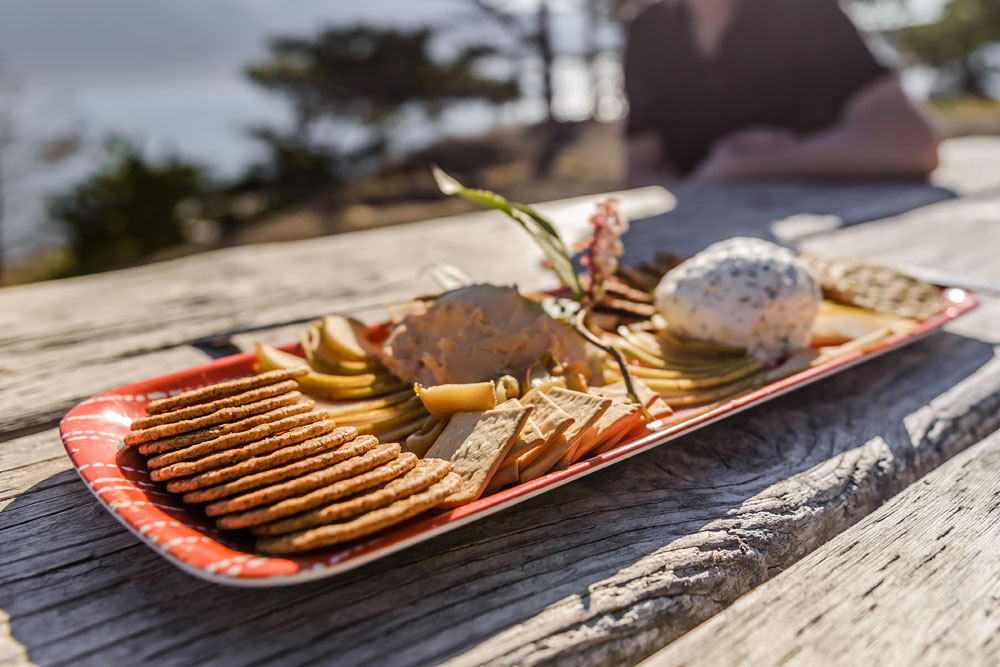 A cheese and cracker board provided as one of the snacks during the Glamping tours