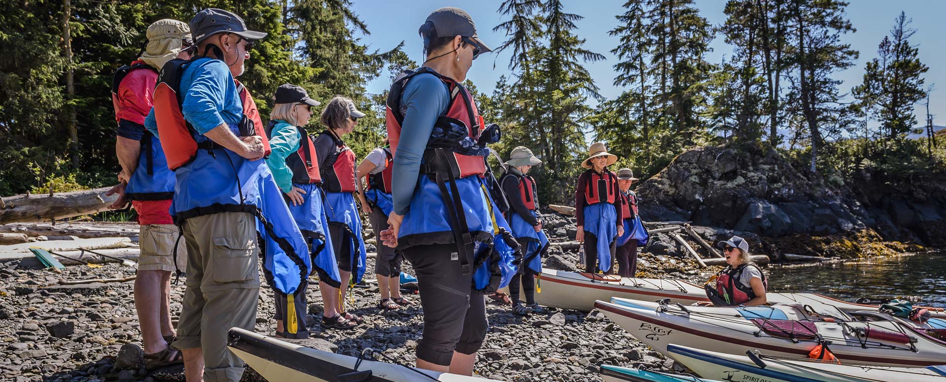 Group of kayakers on the beach