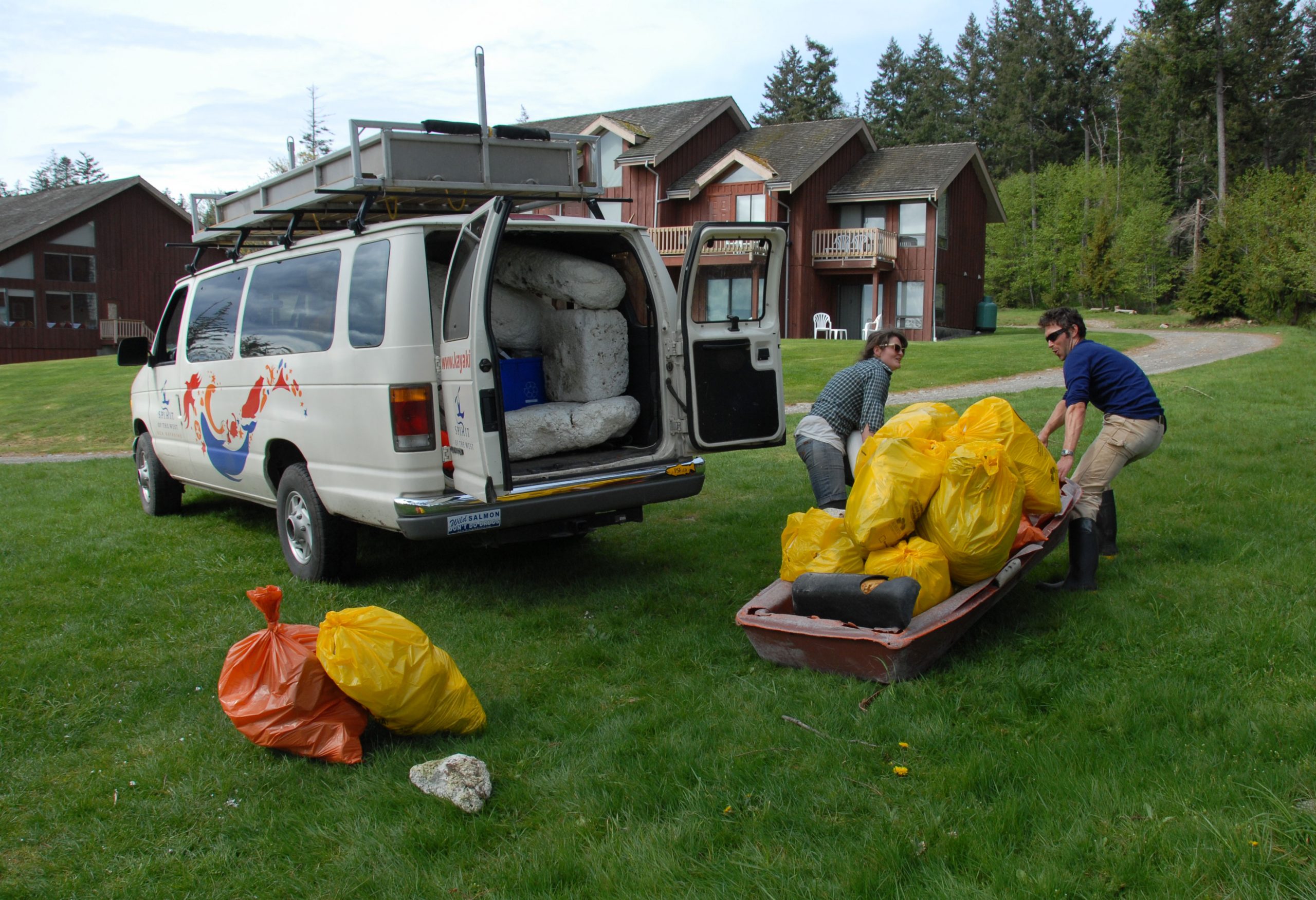 two people assisting with environmental responsibility and clean-up efforts