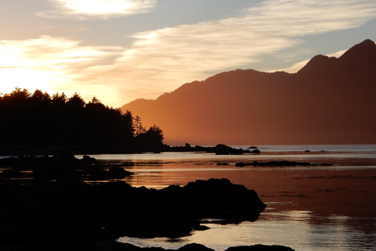 sunset over the mountains and ocean