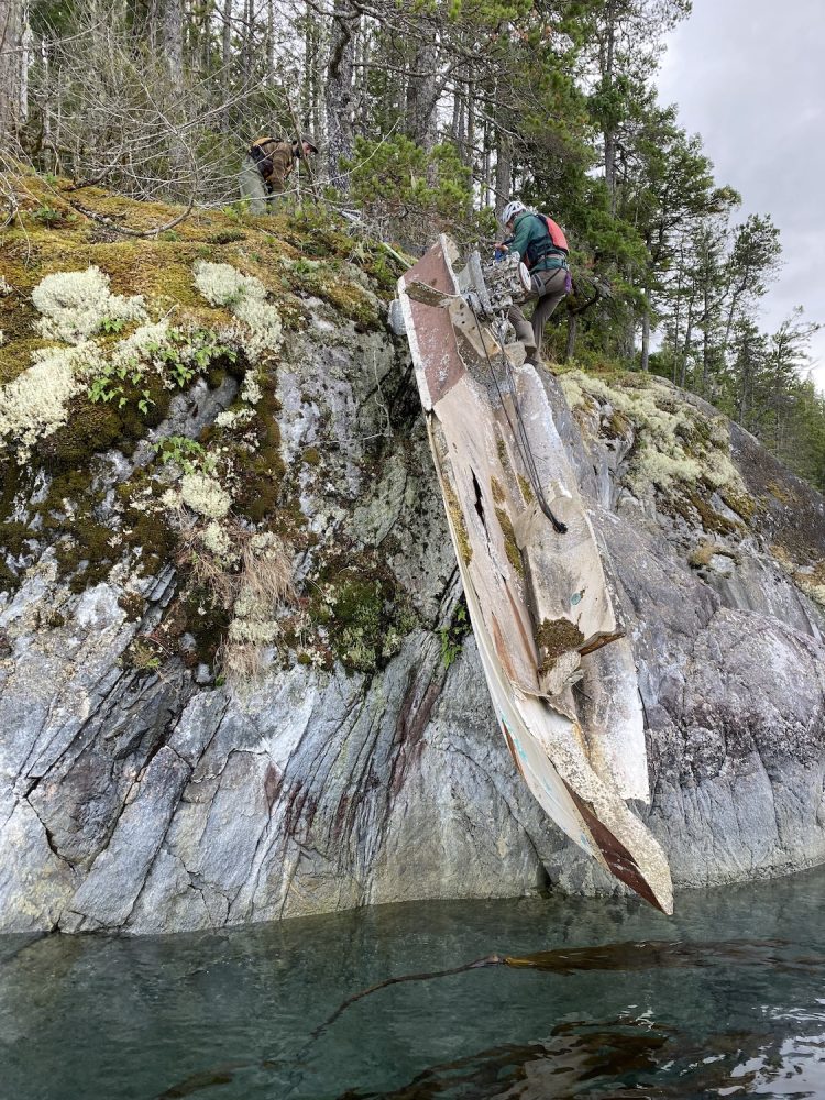 Derelict boat hanging from a cliff on Quadra Island
