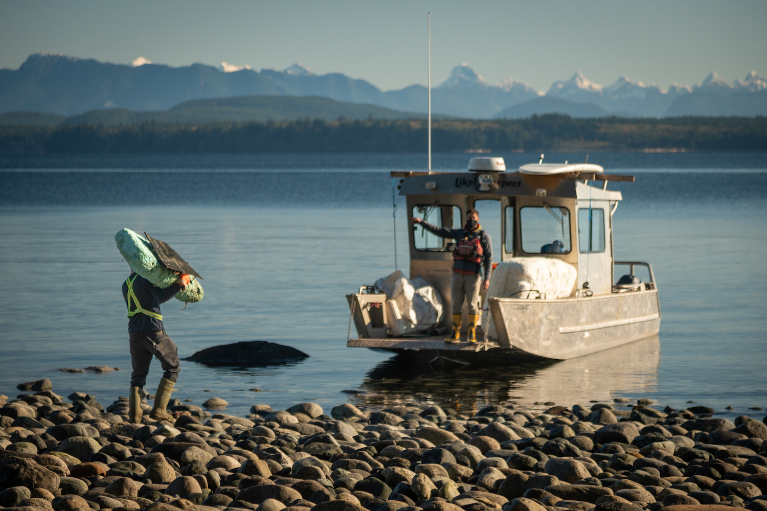 Moving Debris to Boat with Desolation Sound in the background