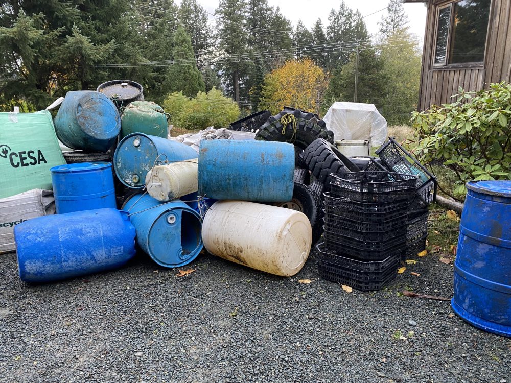 Pile of barrels and other marine debris at Quadra Island operations base