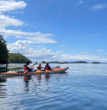 A family kayaking in the Johnstone Strait