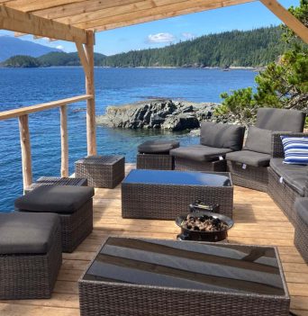 An outdoor lounge area overlooking the Johnstone Strait