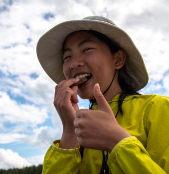 A person enjoying a snack after kayaking in the Johnstone Strait