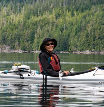 Happy kayaker resting on the Johnstone Strait