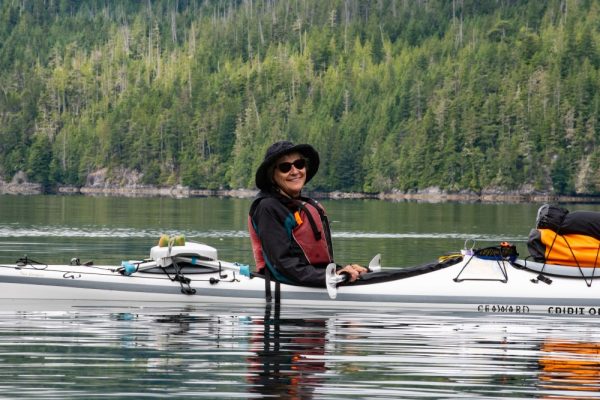 Happy kayaker resting on the Johnstone Strait