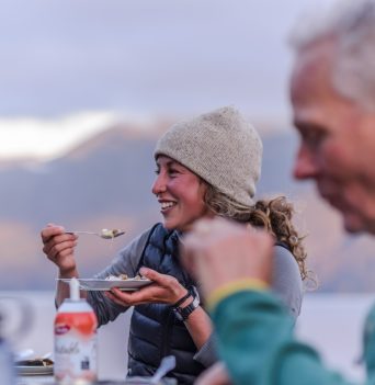 Guests happily enjoying meal together
