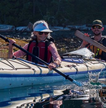 Twin kayak paddling close to shore