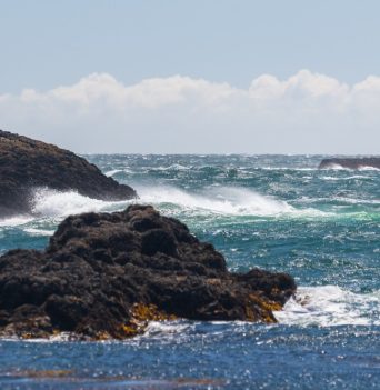 Crashing waves on rocky shore