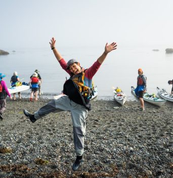 Excited guide kayaking tour