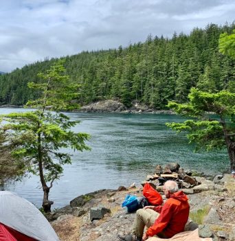 People resting along the rocky bluffs