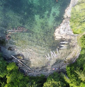 Arial view of kayaker in BC cove