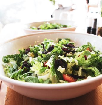 Greens salad served on sunny day during glamping tour