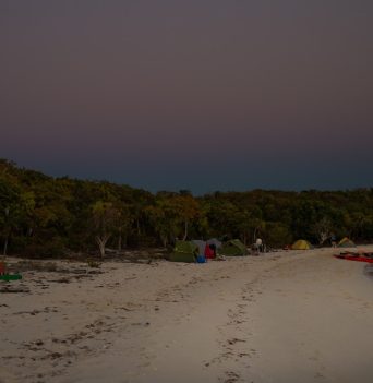A sandy beach in The Bahamas at dusk
