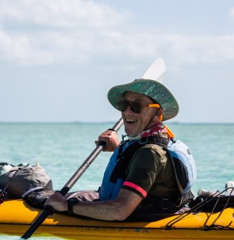 An enthusiastic sea kayaker paddling