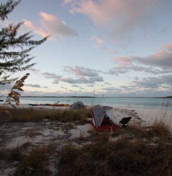 Camping on the beach in The Bahamas at sunset