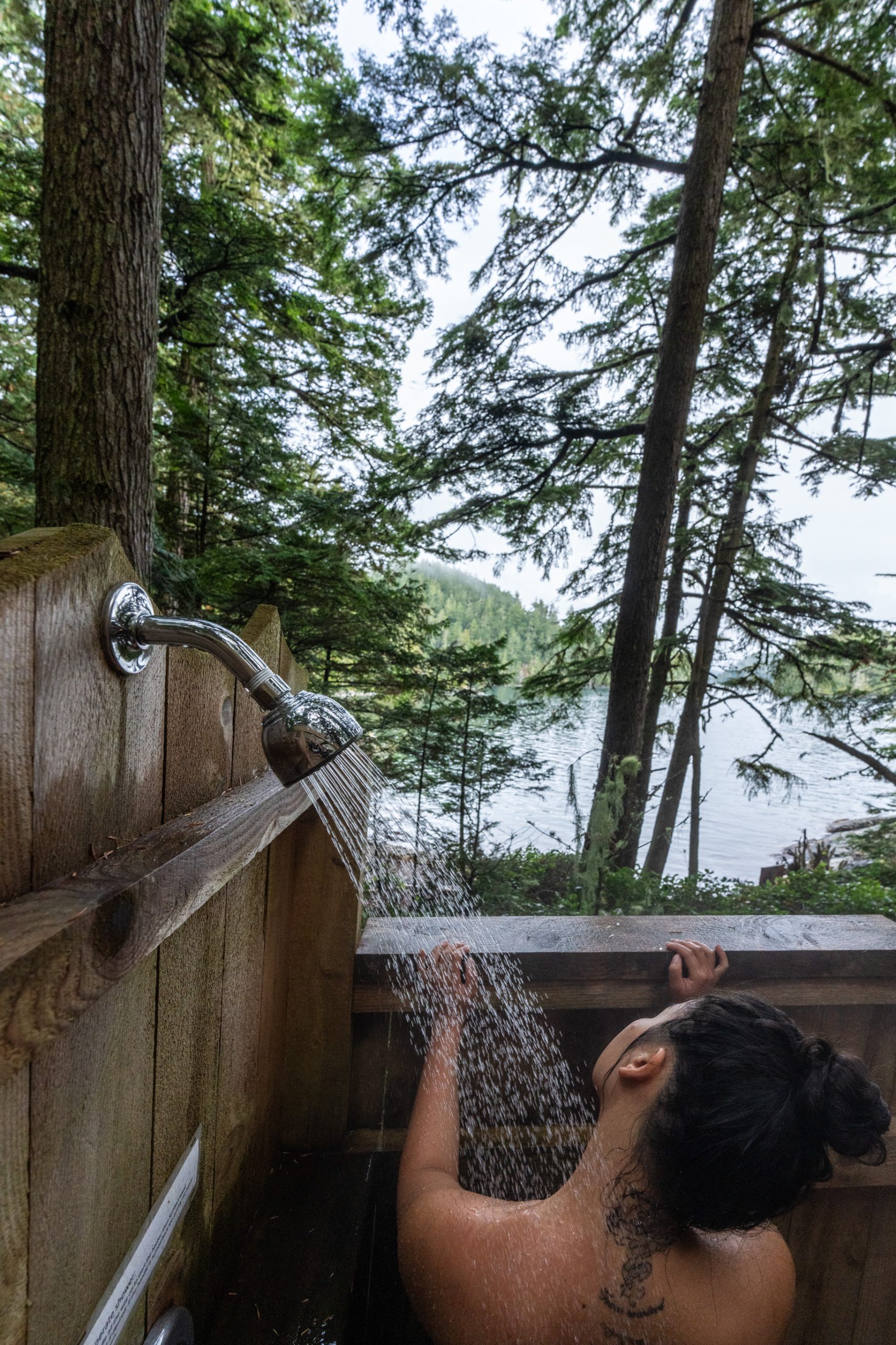 Woman an outdoor shower