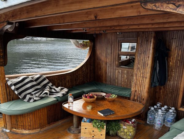 A wooden lounge area onboard an expedition yacht in Chile