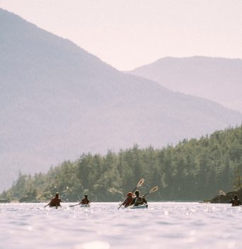 A group of sea kayakers making a crossing off Northern Vancouver Island
