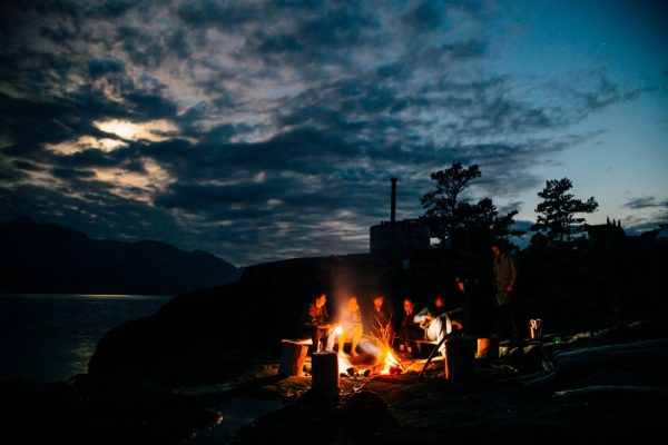 A group of people having a beach fire in BC