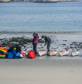 Kayakers packing their kayaks in the Great Bear Rainforest