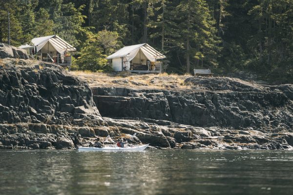 Kayakers in front of Johnstone Strait glamping tents